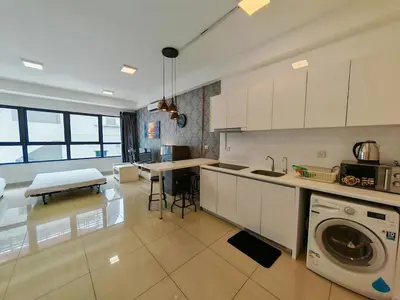 a kitchen with a washer and dryer in a room at Arte Plus by Jerry in Kuala Lumpur