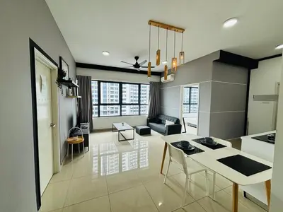 a kitchen and living room with a table and a couch at Arte Plus by Jerry in Kuala Lumpur