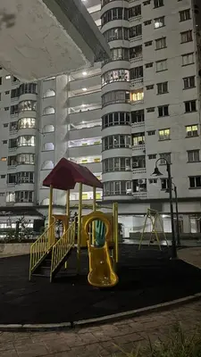 a playground in a city with tall buildings at Homestay in Kuala Lumpur