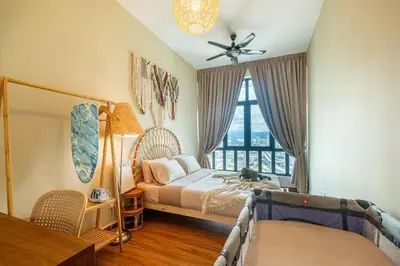 a bedroom with a bed and a large window at Legasi Residence By Feel Home in Kuala Lumpur