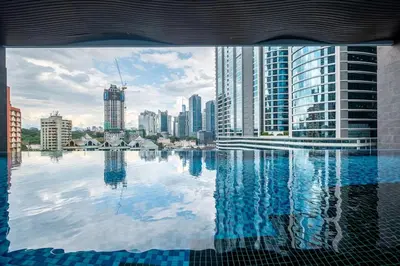 a view of a city skyline from a swimming pool at 38 Bangsar by Feel Home in Kuala Lumpur
