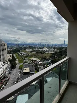 a view of a city from the balcony of a building at Modern Studio Escape in Kuala Lumpur