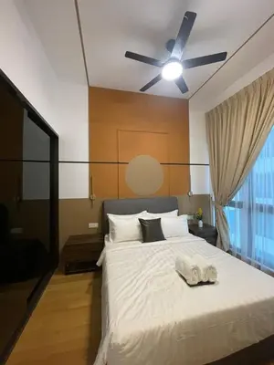 a bedroom with a white bed with a ceiling fan at Cheapest 2R2B in the Heart of KL in Kuala Lumpur