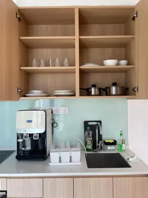 a kitchen with a sink and a coffee maker at The Colony Infinitum by Manila in Kuala Lumpur