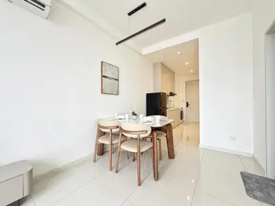 a kitchen and dining room with a table and chairs at Majestic Calm 1BR Suite with Rooftop Infinity Pool in Kuala Lumpur