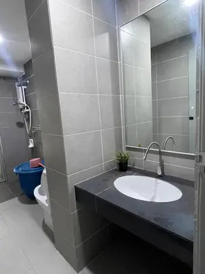 a bathroom with a sink and a toilet at Nour Homestay KLCC View - COZY 1 in Kuala Lumpur