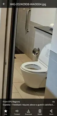 a bathroom with a white toilet in a stall at Platinum Inn Bukitbintang in Kuala Lumpur
