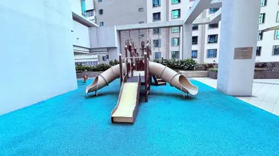 a slide in the middle of a building at Cozyhome suites Swiss Garden Residance in Kuala Lumpur