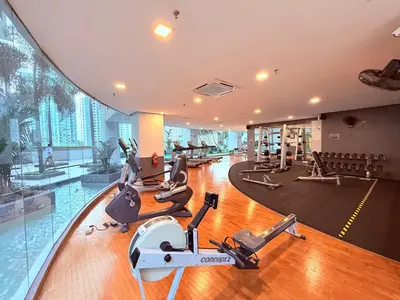 a gym with treadmills and exercise equipment in a building at Cozyhome suites Swiss Garden Residance in Kuala Lumpur