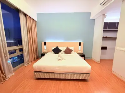 a bedroom with a large bed in a room at Cozyhome suites Swiss Garden Residance in Kuala Lumpur