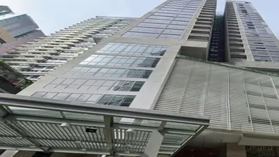 a tall building with a lot of windows at Apartment Sixceylon City Centre in Kuala Lumpur