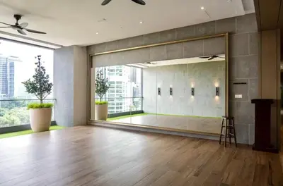 a large mirror in a large room with a large window at Friendly & Cozy Near TRX & Pavilion in Kuala Lumpur