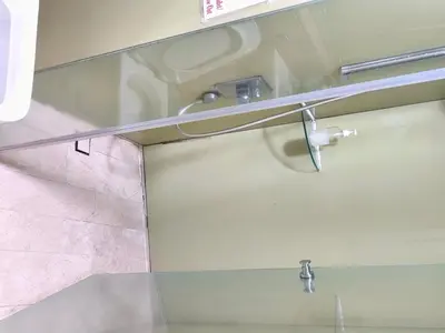 a bathroom with a glass shower with a sink at Vortex suites klcc by ARICA in Kuala Lumpur
