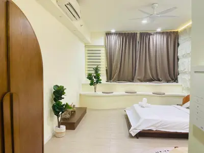 a bedroom with a bed and a bath tub at Chambers suites KLCC by Infinity in Kuala Lumpur