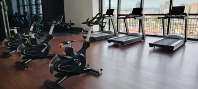 a gym with rows of exercise bikes in a building at Chambers suites KLCC by Infinity in Kuala Lumpur