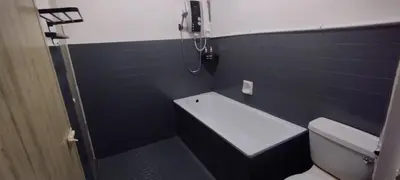 a small bathroom with a toilet and a shower at Segambut Homestay MITEC KLCC PWTC 13 paxs in Kuala Lumpur
