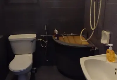 a bathroom with a toilet and a sink and a tub at Segambut Homestay MITEC KLCC PWTC 13 paxs in Kuala Lumpur