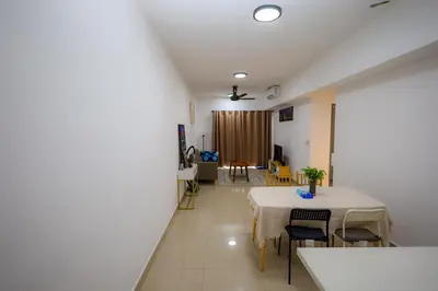 a living room with a table and chairs at M Arisa KL City View by AT in Kuala Lumpur