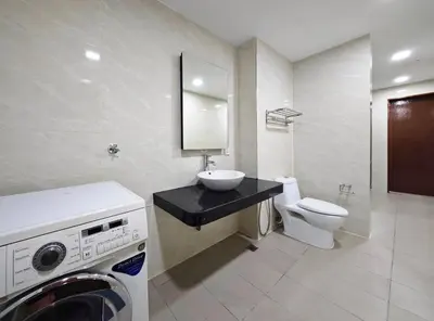 a bathroom with a sink and a washing machine at Bukit Bintang Fairlane Residence #1810 Kuala Lumpur in Kuala Lumpur