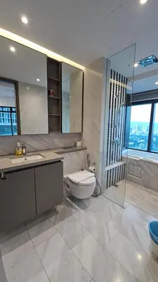 a bathroom with a toilet and a sink and a shower at Crystal Exclusive Suites KLCC in Kuala Lumpur