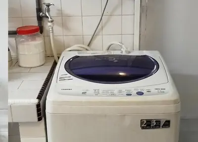 a washing machine in a bathroom with a sink at Segambut House near MITEC KLCC PWTC 14 paxs in Kuala Lumpur
