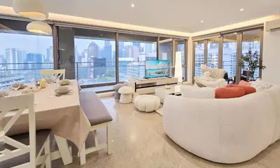 a living room with white furniture and large windows at Panoramic KL View Bintang Fairlane Residence 3BR #21 in Kuala Lumpur