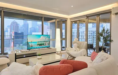 a living room with a large screen tv in a building at Panoramic KL View Bintang Fairlane Residence 3BR #21 in Kuala Lumpur