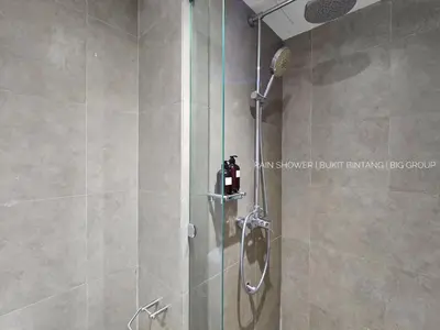 a shower with a glass door in a bathroom at Panoramic KL View Bintang Fairlane Residence 3BR #21 in Kuala Lumpur