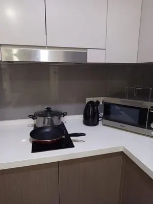 a pot and a pan on a stove in a kitchen at KL Residence By Agile Suites in Kuala Lumpur