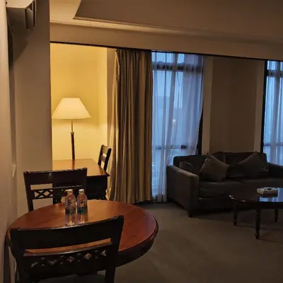 a living room with a couch and a table at Home World Apartment At Times Square in Kuala Lumpur