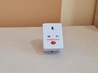 a white electronic device sitting on a floor at Home For Traveler At Majestic Residence in Kuala Lumpur