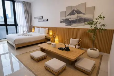a hotel room with a bed and a table at KLCC Majestic Residence By Vglory Home in Kuala Lumpur