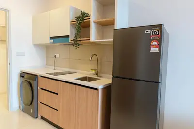 a kitchen with a stainless steel refrigerator and a dishwasher at KLCC Majestic Residence By Vglory Home in Kuala Lumpur