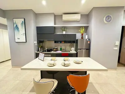 a kitchen with a table with chairs and a counter top at Lucentia Universal Stay Kuala Lumpur in Kuala Lumpur