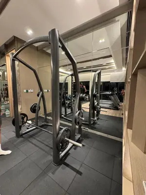 a gym with a mirror and some equipment at KLCC View Suites By Agile in Kuala Lumpur