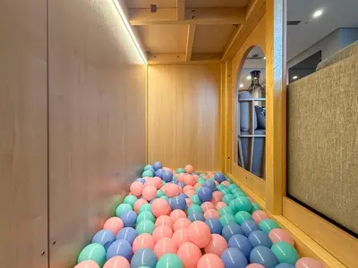 a room with a bunch of balls on the floor at KLCC Spacious Top Floor, Grand, Slides and Big Bathtub Kula Lumpur in Kuala Lumpur