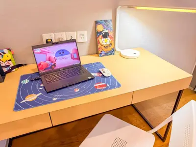 a laptop computer sitting on top of a desk at KLCC Spacious Top Floor, Grand, Slides and Big Bathtub Kula Lumpur in Kuala Lumpur