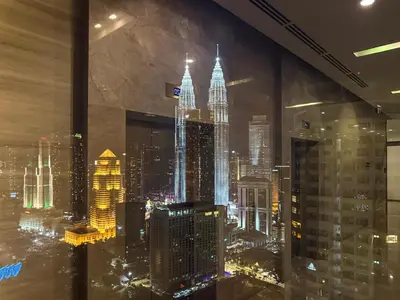 a view of a city skyline at night at KLCC Spacious Top Floor, Grand, Slides and Big Bathtub Kula Lumpur in Kuala Lumpur