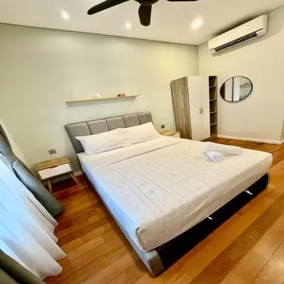 a bedroom with a large bed in a room at sky suites klcc by dp in Kuala Lumpur