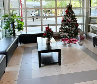 a living room with a christmas tree and a coffee table at Happy Homes Kuala Lumpur 21-12 in Kuala Lumpur