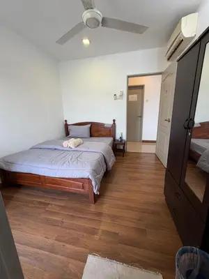 a bedroom with a bed and a ceiling fan at Happy Homes Kuala Lumpur 21-12 in Kuala Lumpur
