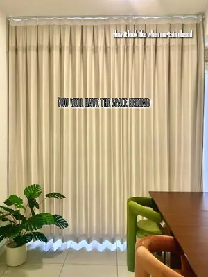 a curtain in a room with a wooden table and a tableablish at Only Girls Condo at KL city, near monorail in Kuala Lumpur