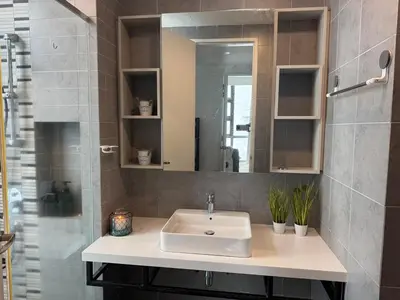 a bathroom with a sink and a mirror at The Robertson N9 Jalan Alor Bukit Bintang Petaling Street 7 Pax in Kuala Lumpur