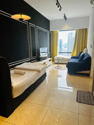 a bedroom with a large bed and a couch at Crystal At Axon Residence KL in Kuala Lumpur
