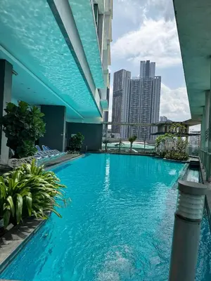 a large swimming pool on the roof of a building at Bukit Bintang By Eryan Guest House in Kuala Lumpur