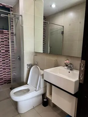 a bathroom with a toilet and a sink at Bukit Bintang By Eryan Guest House in Kuala Lumpur