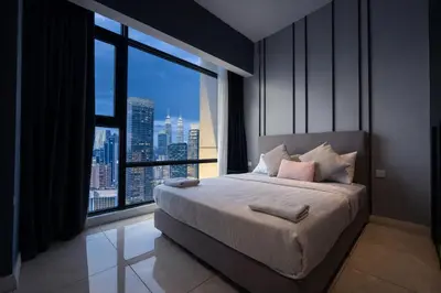 a bedroom with a large bed with a large window at Axon Bukit Bintang By Sleeping Bird in Kuala Lumpur