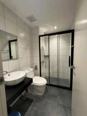 a bathroom with a toilet and a sink and a shower at Chamber Residence klcc by Cozy Dream in Kuala Lumpur
