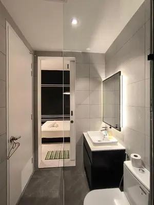 a bathroom with a sink and a toilet and a shower at Tour & Travel Malaysia Axon Residence Bukit Bintang KL in Kuala Lumpur
