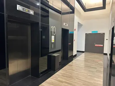 a elevator lobby in a building with black walls at Cherry Homes at Chambers by Golden in Kuala Lumpur